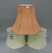 Three lamp shades (two brand new). The largest 44 cm high.