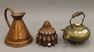 A copper jelly mould, a copper jug and a brass kettle. The latter 23.5 cm high.