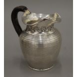 A ribbed silver jug. 14 cm high. 363.4 grammes total weight.