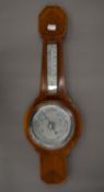 A British banjo barometer and thermometer in fahrenheit and centigrade,