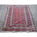 A red and blue ground wool rug. 128 x 196 cm.