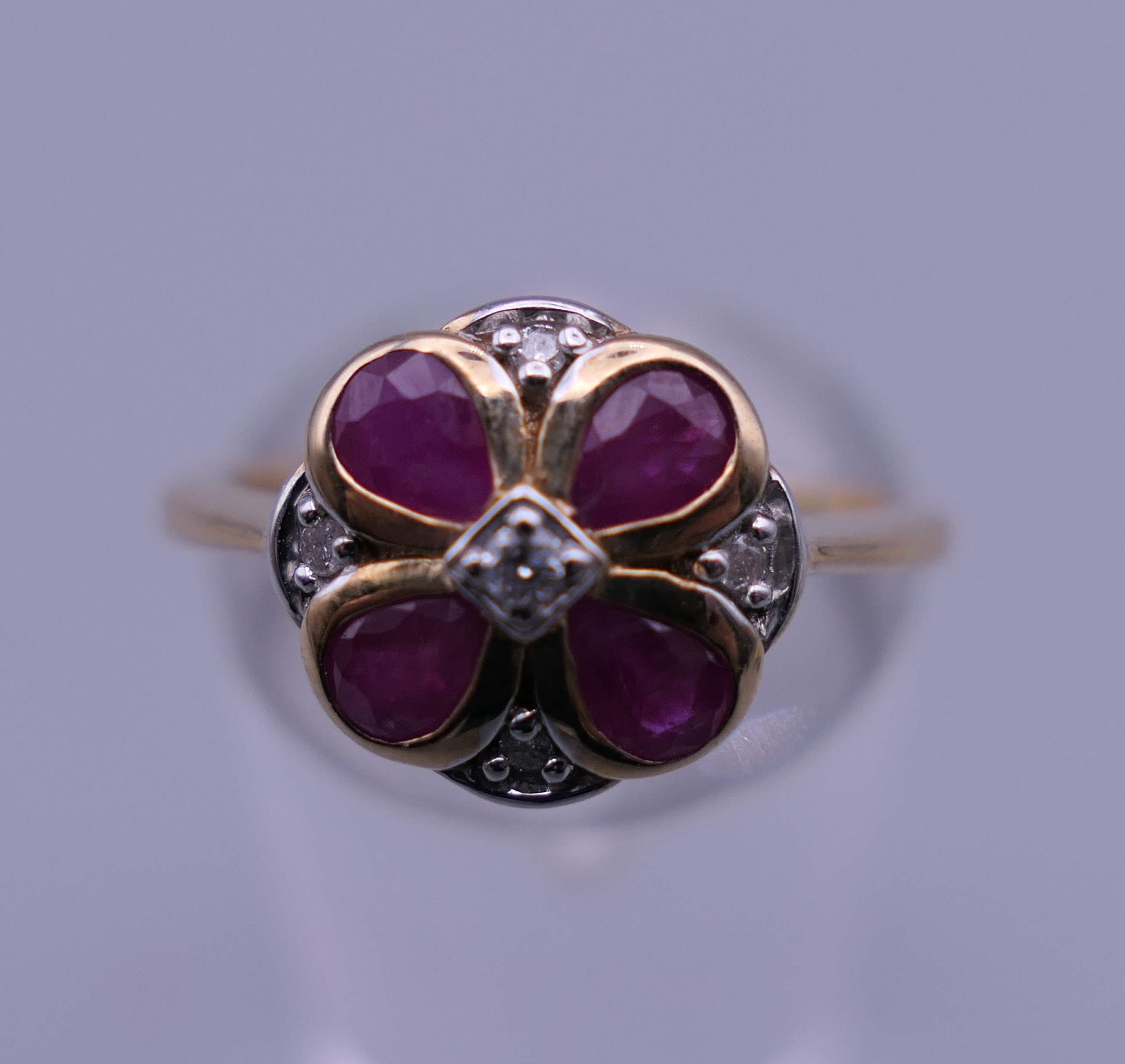 A 9 ct gold ruby and diamond flower ring. Ring size M. - Image 2 of 6