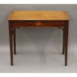 An Edwardian mahogany inlaid side table. 83 cm wide.