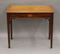 An Edwardian mahogany inlaid side table. 83 cm wide.