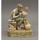 A 19th century Continental porcelain model of a potter.