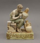 A 19th century Continental porcelain model of a potter.