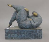 An abstract bronze sculpture of a large lady. 25 cm long.