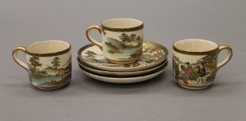 Three 19th century Japanese Satsuma cups and saucers. The cups 5 cm high.