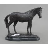 A bronze model of a horse on a plinth base. 25 cm long.