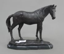 A bronze model of a horse on a plinth base. 25 cm long.