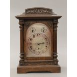 An early 20th century oak cased Westminster chime on gong mantle clock. 44 cm high.