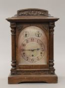 An early 20th century oak cased Westminster chime on gong mantle clock. 44 cm high.