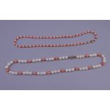 A coral and pearl bead necklace and another similar, each set with a 9 ct gold clasp.