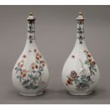 A pair of 18th/19th century kakiemon palette bottle vases with lids. 19 cm high.