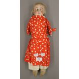 A 19th century German bisque headed doll. 43.5 cm tall.