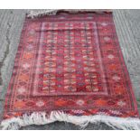 Two red ground wool rugs. 161 x 108 cm and 123.5 x 202 cm respectively.