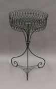 A Victorian wire work plant stand. 82 cm high.