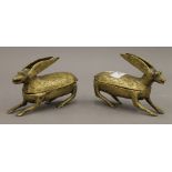 A pair of African brass boxes formed as hares. 15 cm long.