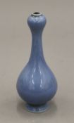 A small Chinese blue porcelain onion top vase. 16.5 cm high.