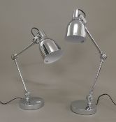 A pair of chrome anglepoise lamps.