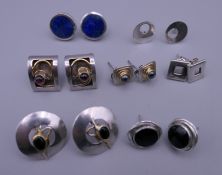 A quantity of various silver earrings.