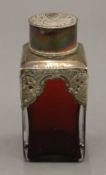 A silver mounted ruby glass caddy. 12.5 cm high.