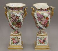 A pair of 19th century French Jakob Petit florally painted porcelain vases. 46.5 cm high.