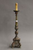 A Victorian brass and copper altar stick. 78.5 cm high.