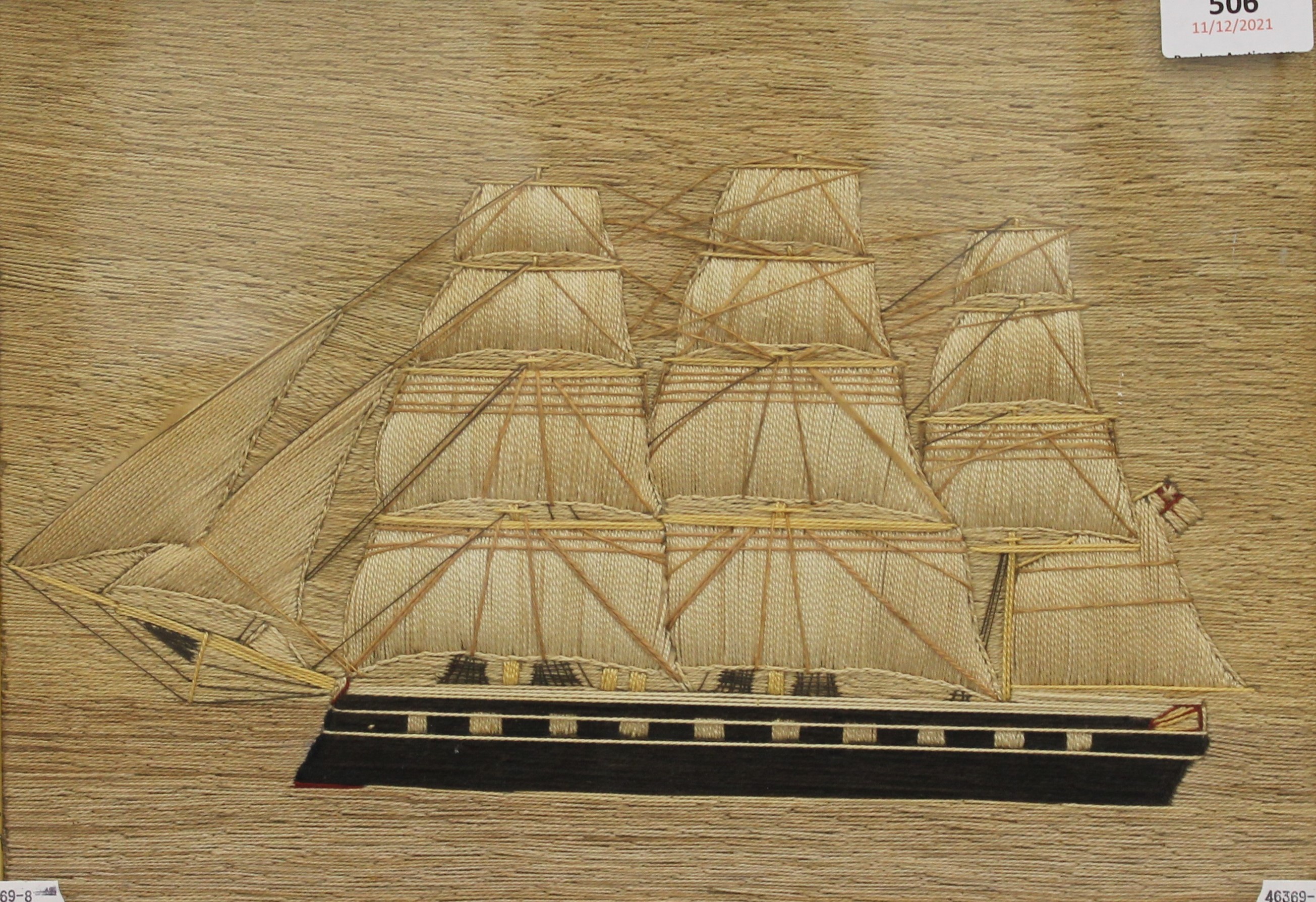 An antique sailors woolwork picture of a Sailing Ship, framed and glazed. 43 x 33 cm overall.