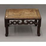 A late 19th/early 20th century Chinese carved hardwood low rectangular stand. 47.5 cm wide.