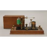 A late 19th century walnut cased electrotherapy machine. 30 cm wide.