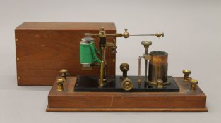 A late 19th century walnut cased electrotherapy machine. 30 cm wide.