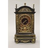 A 19th century brass mounted ebonised bracket clock on stand. The clock 31.5 cm high.