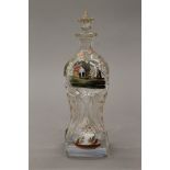 A 19th century painted glass decanter. 27 cm high.