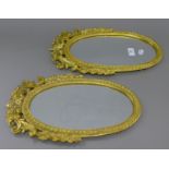 A pair of brass mirrors. 39 cm high.