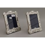A pair of silver photograph frames. 20 cm high.