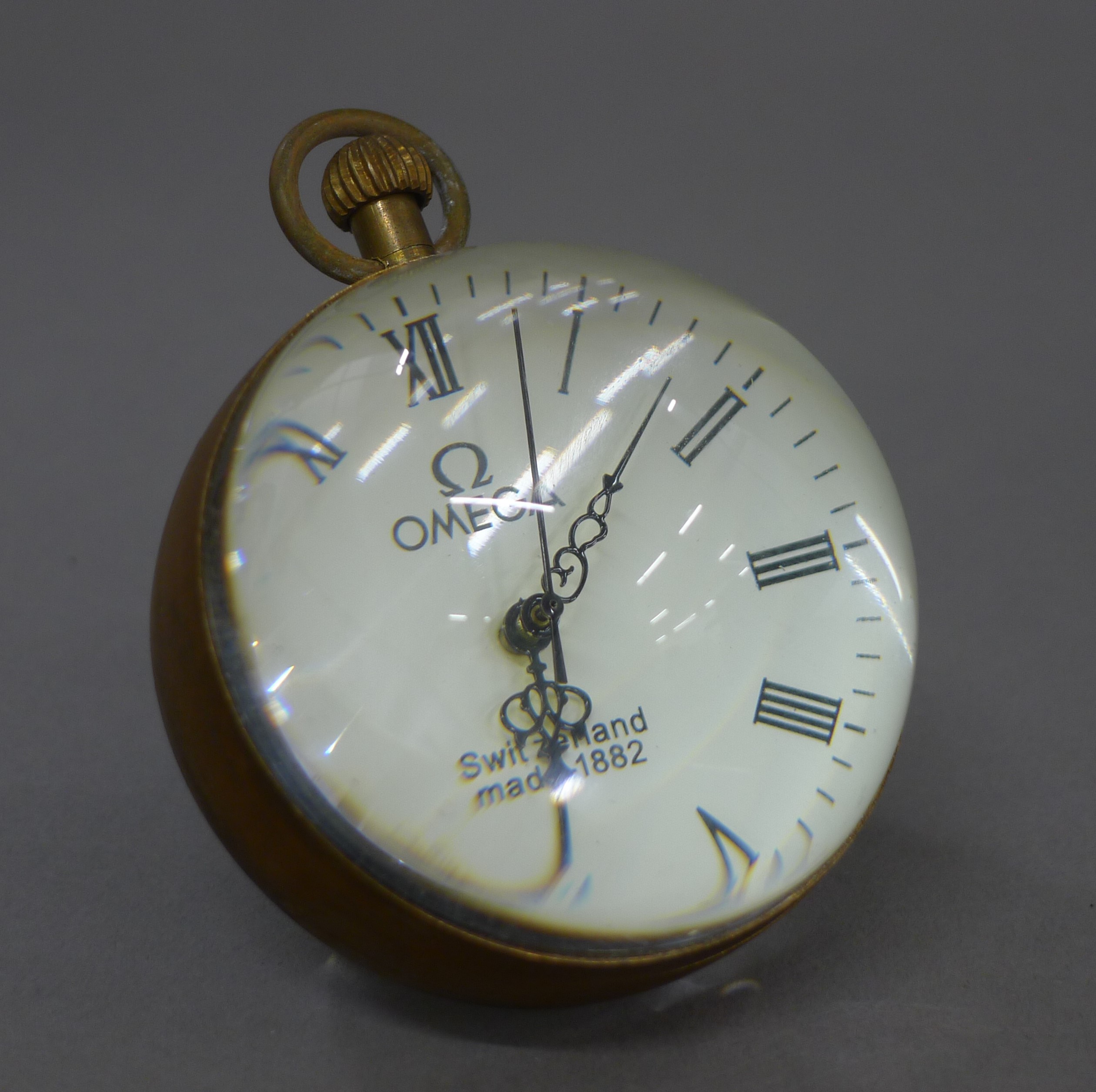 A ball clock. 6 cm high.