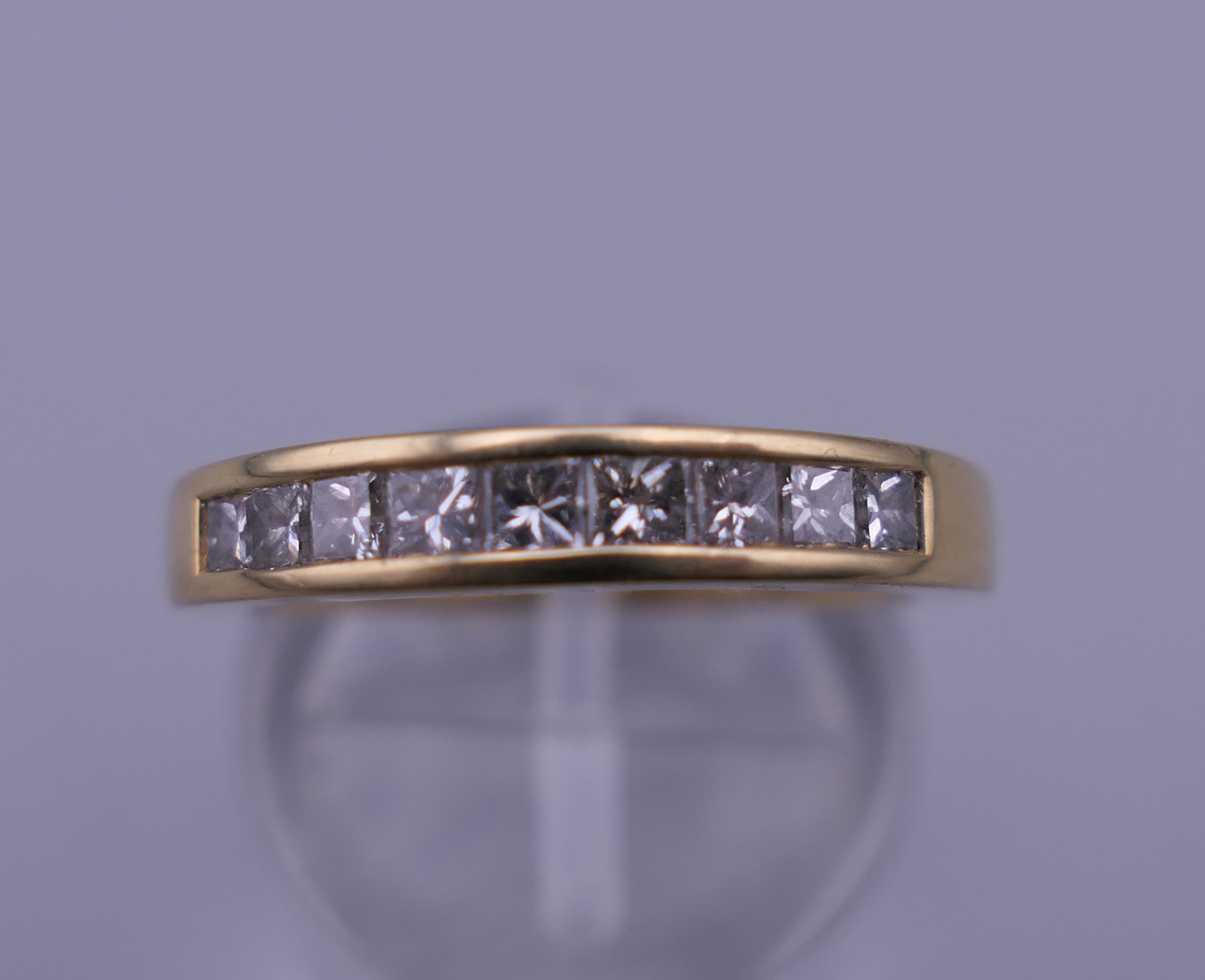 An 18 ct gold diamond ring set with 1/2 carat of diamonds. Ring M/N. 4.4 grammes total weight.