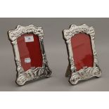 A pair of silver photograph frames. 21 cm high.