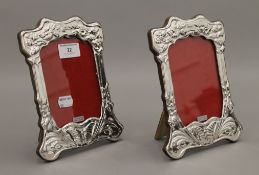 A pair of silver photograph frames. 21 cm high.
