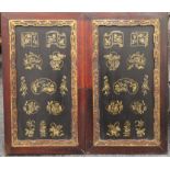 A pair of Chinese lacquered door panels. Each 46 x 80 cm.