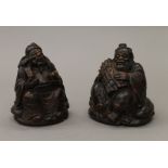 Two carved bamboo figures. The largest 15 cm high.