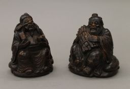 Two carved bamboo figures. The largest 15 cm high.