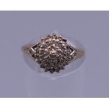 A 9 ct gold diamond cluster ring. 1/4 carat diamond weight. Ring size K/L. 2.5 grammes total weight.