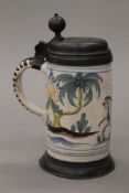 An 18th century German pewter mounted pottery stein. 23 cm high.