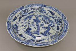 A Chinese blue and white porcelain charger. 51 cm diameter.