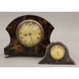 A mantle clock and a desk clock. The former 15 cm high.