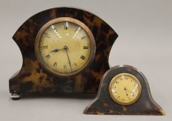 A mantle clock and a desk clock. The former 15 cm high.