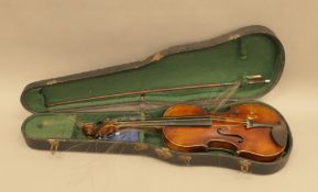 A vintage cased violin.