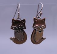A pair of silver earrings formed as foxes. 2.5 cm high.